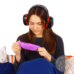 girl in a sensory corner wearing ultimate 10 earmuffs