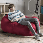 boy reclining on a lounger beanbag chair