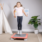 girl jumping on a bounce board trampoline