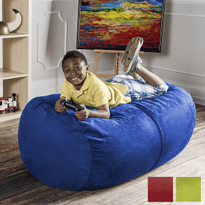 boy laying on a blue lounger beanbag chair in a sensory corner