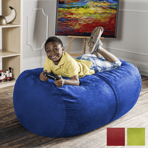 boy laying on a blue lounger beanbag chair in a sensory corner