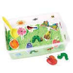 sensory bin with green kinetic sand, characters from the very hungry caterpillar, and a shovel