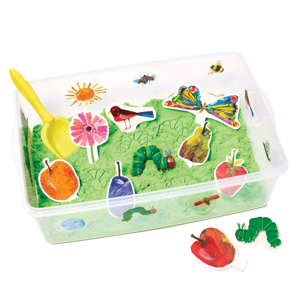 sensory bin with green kinetic sand, characters from the very hungry caterpillar, and a shovel