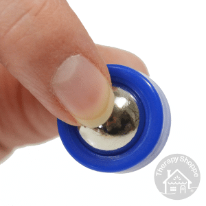 mini sensory finger roller being held in someone's fingertips