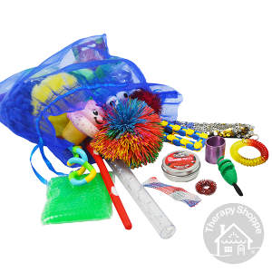 blue organza drawstring bag with lots of different fidgets spilling out of it