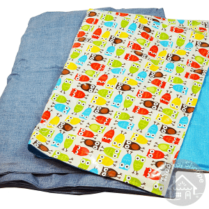 laminate weighted blankets. one has blue fabric and one has an owl print