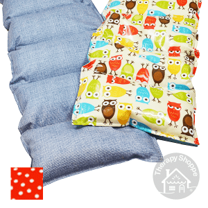 Wipe clean weighted lap pads. One has a blue denim pattern and the other has a colorful owl pattern